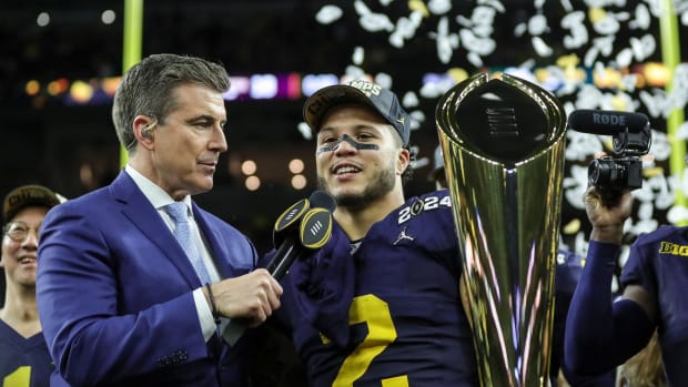 Michigan running back Blake Corum (2), along with Rece Davis, celebrates the Wolverines' 34-13 win over Washington at the national championship game at NRG Stadium in Houston on Monday, Jan. 8, 2024.